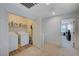 Upper level laundry room with washer, dryer, and shelving at 4132 Spring Storm Ave, North Las Vegas, NV 89081