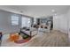 Open concept living room with kitchen and island at 4132 Spring Storm Ave, North Las Vegas, NV 89081