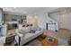 Open concept living room with kitchen view at 4132 Spring Storm Ave, North Las Vegas, NV 89081