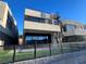 Three-story modern home featuring a rooftop terrace and beautiful landscaping at 42 Promenade Isle Ln, Henderson, NV 89011