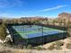 Well-maintained tennis courts with mountain views at 42 Promenade Isle Ln, Henderson, NV 89011