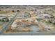 Expansive aerial view of desert property showcasing a single-story home and adjacent buildings at 2510 N Woodchips Rd, Pahrump, NV 89060