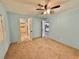 Bedroom featuring neutral carpet, two doors and light blue walls at 2510 N Woodchips Rd, Pahrump, NV 89060