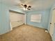 Bedroom featuring neutral carpet, built-in closet space and white double doors at 2510 N Woodchips Rd, Pahrump, NV 89060