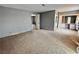 Bedroom with carpet, gray walls, vanity with lighting, and mirrored closet doors at 2510 N Woodchips Rd, Pahrump, NV 89060