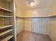 Spacious walk-in closet with shelving and rod for ample storage at 2510 N Woodchips Rd, Pahrump, NV 89060