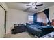 Simple bedroom with double bed and ceiling fan at 4690 E Utah Ave, Las Vegas, NV 89104