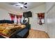 Main bedroom with a large bed and ceiling fan at 4690 E Utah Ave, Las Vegas, NV 89104