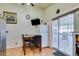 Kitchen with breakfast table, sliding door to patio, and white fridge at 4690 E Utah Ave, Las Vegas, NV 89104