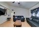 Spacious living room featuring hardwood floors and comfortable leather sofas at 4690 E Utah Ave, Las Vegas, NV 89104