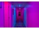 Pink and blue-lit hallway with tile floors and doors at 150 Las Vegas Blvd # 814, Las Vegas, NV 89101