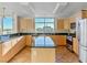 Modern kitchen with island, granite counters, and city views at 150 Las Vegas Blvd # 814, Las Vegas, NV 89101