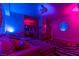 Living room with purple and blue lighting, modern decor and hardwood floors at 150 Las Vegas Blvd # 814, Las Vegas, NV 89101