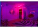 Living area with purple lighting, modern decor and hardwood floors at 150 Las Vegas Blvd # 814, Las Vegas, NV 89101