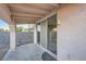 Covered back patio with sliding glass door and view of the backyard at 3456 Beca Faith Dr, North Las Vegas, NV 89032