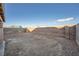 Large backyard with block wall and gravel at 3456 Beca Faith Dr, North Las Vegas, NV 89032