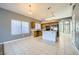 Open concept kitchen features stainless steel appliances, a kitchen island, and plenty of natural light at 3456 Beca Faith Dr, North Las Vegas, NV 89032