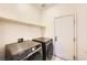 Functional laundry room equipped with modern washer and dryer units at 3456 Beca Faith Dr, North Las Vegas, NV 89032