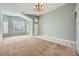 Open living room with vaulted ceiling and neutral color scheme at 3456 Beca Faith Dr, North Las Vegas, NV 89032