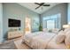 Serene primary bedroom featuring a large window and an en-suite bathroom at 3456 Beca Faith Dr, North Las Vegas, NV 89032