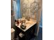 Clean bathroom with dark vanity and decorative wall art at 10753 Cather Ave, Las Vegas, NV 89166