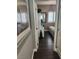 Clean hallway with dark hardwood floors and access to bedrooms at 10753 Cather Ave, Las Vegas, NV 89166