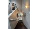 Modern staircase with dark wood steps and gray walls at 10753 Cather Ave, Las Vegas, NV 89166