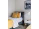 Cozy bedroom featuring a twin bed with stylish yellow accents and modern decor at 175 Enloe St, Henderson, NV 89074