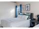 Bedroom featuring a comfortable bed with green and white bedding, complimented by modern decor at 175 Enloe St, Henderson, NV 89074