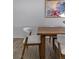Stylish dining room with modern wood table, chairs, and wood flooring at 175 Enloe St, Henderson, NV 89074