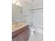 Bathroom featuring a vanity with a marble countertop, tiled floors, and a shower-tub combo at 1965 Scimitar Dr # 0, Henderson, NV 89014