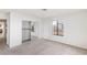 Bright bedroom featuring plush carpeting, natural light from window, and mirrored closet at 1965 Scimitar Dr # 0, Henderson, NV 89014