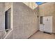 Exterior entry featuring modern door, textured stucco, and well-lit walkway at 1965 Scimitar Dr # 0, Henderson, NV 89014