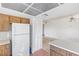 A kitchen featuring white appliances and tiled floors at 1965 Scimitar Dr # 0, Henderson, NV 89014