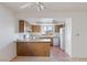 Kitchen featuring wooden cabinets, white appliances, and a tiled backsplash at 1965 Scimitar Dr # 0, Henderson, NV 89014