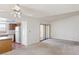 A bright living room connected to the kitchen and featuring a sliding glass door at 1965 Scimitar Dr # 0, Henderson, NV 89014