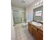 Bathroom with tub shower combo, vanity, and tile floor at 2521 Sierra Luna Ave # 106, Las Vegas, NV 89106