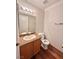 Clean bathroom with granite vanity and wood flooring at 2521 Sierra Luna Ave # 106, Las Vegas, NV 89106