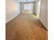 Spacious carpeted bedroom with large window at 2521 Sierra Luna Ave # 106, Las Vegas, NV 89106