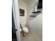 Clean and modern half bathroom with pedestal sink and floating shelves at 2609 Via Napoli, Henderson, NV 89044