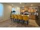 Kitchen with island and four yellow barstools at 2609 Via Napoli, Henderson, NV 89044