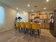 Kitchen with island and four yellow barstools at 2609 Via Napoli, Henderson, NV 89044