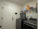 Laundry room includes shelving and a door to outside at 2609 Via Napoli, Henderson, NV 89044