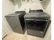 Laundry room with side-by-side Whirlpool washer and dryer at 2609 Via Napoli, Henderson, NV 89044