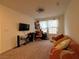 Multi-purpose room with comfortable seating and a workspace at 2609 Via Napoli, Henderson, NV 89044