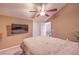 Comfortable bedroom with a ceiling fan and access to a patio at 2925 Wigwam Pkwy # 2021, Henderson, NV 89074