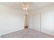 Spacious bedroom with ceiling fan, carpet, and access to bathroom at 412 Vassar Ln, Las Vegas, NV 89107