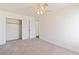 Bright bedroom with mirrored closet doors and ceiling fan at 412 Vassar Ln, Las Vegas, NV 89107