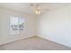 Well-lit bedroom with ceiling fan and carpeted floors at 412 Vassar Ln, Las Vegas, NV 89107