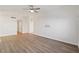 Bright living room with wood-look floors and ceiling fan at 412 Vassar Ln, Las Vegas, NV 89107